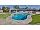 Backyard with a private pool, a built-in bar, and a covered patio area perfect for entertaining at 811 W Northern Ave, Phoenix, AZ 85021