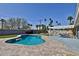 Backyard featuring a refreshing pool, stone patio, and a pergola-covered dining area for relaxing outdoors at 811 W Northern Ave, Phoenix, AZ 85021