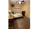 Well-lit bedroom with a queen-size bed and wood-look flooring at 8140 N 107Th Ave # 99, Peoria, AZ 85345