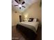 Spacious bedroom with king-size bed and ensuite bathroom access at 8140 N 107Th Ave # 99, Peoria, AZ 85345