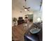 Open living room with hardwood floors, and view of kitchen and dining area at 8140 N 107Th Ave # 99, Peoria, AZ 85345