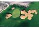 Aerial view of a lush green golf course with sand traps and walking path at 8260 E Sunset View Dr, Gold Canyon, AZ 85118