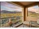 Private balcony with mountain views, outdoor seating and desert landscaping below at 8260 E Sunset View Dr, Gold Canyon, AZ 85118