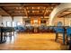 Spacious bar area featuring a wooden bar, wooden floors and ample bar seating at 8260 E Sunset View Dr, Gold Canyon, AZ 85118