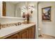 Charming bathroom with custom vanity, decorative mirror, and stylish sconces is ready for guests at 8260 E Sunset View Dr, Gold Canyon, AZ 85118