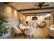 Cozy dining area with stone walls and a view of television at 8260 E Sunset View Dr, Gold Canyon, AZ 85118