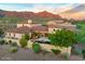 Expansive desert home with red tile roof and breathtaking mountain views, perfect for luxurious living and entertaining at 8260 E Sunset View Dr, Gold Canyon, AZ 85118