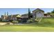 Beautiful home exterior with a large well manicured yard and lovely stone features at 8260 E Sunset View Dr, Gold Canyon, AZ 85118