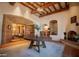Grand foyer with high ceilings, travertine floors and views of the dining room and arched fireplace at 8260 E Sunset View Dr, Gold Canyon, AZ 85118