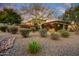 Beautiful desert landscaping and mature trees add curb appeal to this gorgeous, luxury home at 8260 E Sunset View Dr, Gold Canyon, AZ 85118