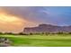 Picturesque golf course with manicured greens, sand traps, and a scenic mountain backdrop at 8260 E Sunset View Dr, Gold Canyon, AZ 85118