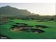 Expansive golf course view with several sand traps and a mountain backdrop at 8260 E Sunset View Dr, Gold Canyon, AZ 85118