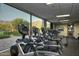 Gym with rows of treadmills facing large windows with stunning mountain views at 8260 E Sunset View Dr, Gold Canyon, AZ 85118