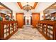 Hallway with beautiful wooden cabinets, mirrors and accent lighting at 8260 E Sunset View Dr, Gold Canyon, AZ 85118