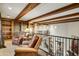 Cozy loft space featuring exposed wood beams, built-in shelves and leather chairs at 8260 E Sunset View Dr, Gold Canyon, AZ 85118