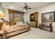 Relaxing bedroom with carpet, ceiling fan, comfortable furniture, and ambient lighting at 8260 E Sunset View Dr, Gold Canyon, AZ 85118