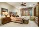 Comfortable bedroom featuring soft lighting, ceiling fan, carpeted floor, and comfortable furniture at 8260 E Sunset View Dr, Gold Canyon, AZ 85118
