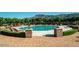 A beautiful community pool with stone accents and nearby landscaping at 8260 E Sunset View Dr, Gold Canyon, AZ 85118