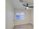 Bright bedroom with ceiling fan and wood-look flooring at 849 W Mitchell Dr, Phoenix, AZ 85013