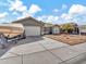 One-story home with a two-car garage and desert landscaping at 8535 W Denton Ln, Glendale, AZ 85305