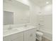 Bright bathroom featuring double sinks, white cabinetry, and a shower-tub combination at 8636 W Warner St, Tolleson, AZ 85353