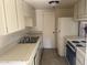 Efficient kitchen with double sink, gas range, and ample cabinet space at 8861 N 12Th Pl, Phoenix, AZ 85020