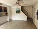 Living area with tile floors, staircase, and neutral color walls at 8861 N 12Th Pl, Phoenix, AZ 85020