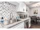 Updated kitchen boasts stylish backsplash and ample counter space at 954 E Diamond Dr, Tempe, AZ 85283