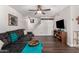 Spacious living room with sectional sofa, wood floors, and staircase at 954 E Diamond Dr, Tempe, AZ 85283