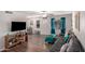 Living room features a sectional sofa, media console, and wood-look floors at 954 E Diamond Dr, Tempe, AZ 85283