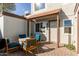 Small patio with seating area located at the townhome's entrance at 954 E Diamond Dr, Tempe, AZ 85283