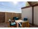 Small patio with table and chairs, adjacent to the townhome at 954 E Diamond Dr, Tempe, AZ 85283