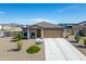 Single-story house with a two-car garage and desert landscaping at 10366 W Camelia Dr, Arizona City, AZ 85123