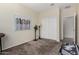 Bright bedroom featuring sliding closet doors and a view into another room at 1081 W Brangus Way, San Tan Valley, AZ 85143