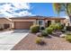 Charming single-story home featuring a well-manicured desert landscape and a brown tiled roof at 1081 W Brangus Way, San Tan Valley, AZ 85143