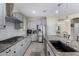 Kitchen featuring granite countertops, stainless steel appliances, modern cabinetry, and a subway tile backsplash at 1081 W Brangus Way, San Tan Valley, AZ 85143