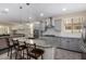 Stylish kitchen with a granite island, stainless steel appliances, gray cabinets, and a modern subway tile backsplash at 1081 W Brangus Way, San Tan Valley, AZ 85143