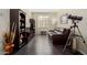 Stylish living room with hardwood floors, leather sofa, and decorative shelving at 1081 W Brangus Way, San Tan Valley, AZ 85143