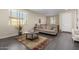 Inviting living room featuring a neutral color palette, a comfortable couch and a large window at 1081 W Brangus Way, San Tan Valley, AZ 85143