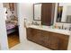 Double vanity bathroom with granite countertop and large mirror at 1112 W Citation Dr, Chandler, AZ 85224