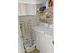 Laundry room with washer, dryer, and ample storage shelves at 1112 W Citation Dr, Chandler, AZ 85224