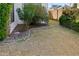 Landscaped side yard with rock border and grassy area at 1112 W Citation Dr, Chandler, AZ 85224