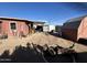 Large backyard with storage shed and covered patio area at 11217 W Missouri Ave, Youngtown, AZ 85363