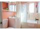 Clean bathroom with white vanity and tub at 11217 W Missouri Ave, Youngtown, AZ 85363