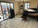 Bedroom with tile floors and sliding glass door at 11217 W Missouri Ave, Youngtown, AZ 85363