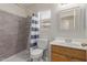 Well-lit bathroom with a shower and tub combination and neutral tile flooring at 11810 W Belmont Dr, Avondale, AZ 85323