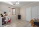 Spacious bedroom with a ceiling fan, closet, and tile flooring at 11810 W Belmont Dr, Avondale, AZ 85323