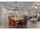 Dining area featuring a stylish chandelier and an abundance of natural light at 11810 W Belmont Dr, Avondale, AZ 85323