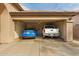 Spacious two-car garage providing parking and storage with a rear entry door at 11810 W Belmont Dr, Avondale, AZ 85323