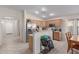 Kitchen featuring stainless steel appliances, wood cabinetry, and breakfast bar at 11810 W Belmont Dr, Avondale, AZ 85323